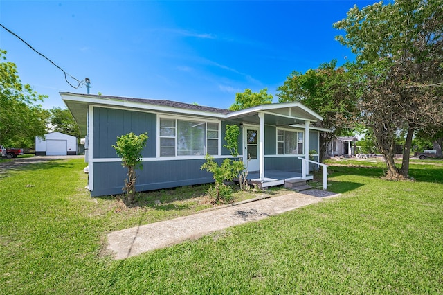 161281/2 Ridlon St, Channelview, TX 77530 - view of front of house featuring a front lawn, a garage, and covered porch