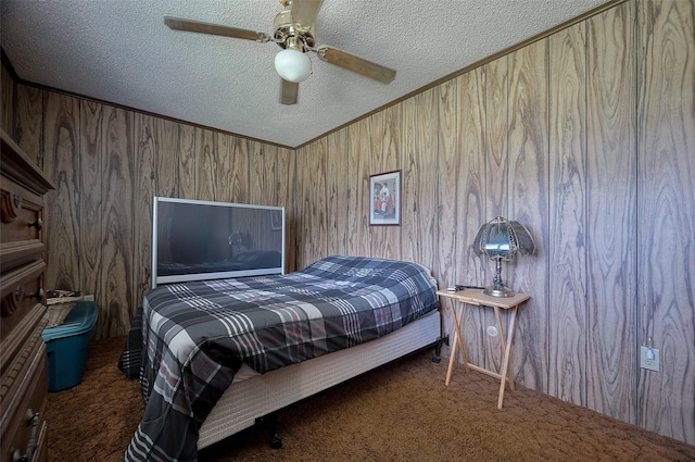 161281/2 Ridlon St, Channelview, TX 77530 - carpeted bedroom featuring a textured ceiling, wood walls, and ceiling fan