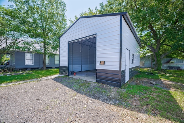 161281/2 Ridlon St, Channelview, TX 77530 - view of outdoor structure with an outbuilding and driveway