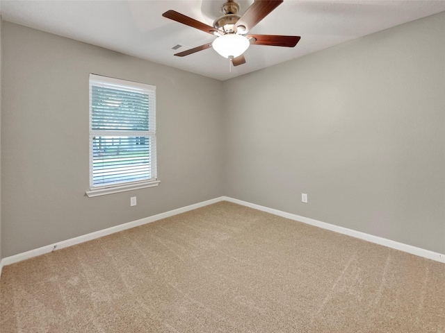 unfurnished room with baseboards, ceiling fan, visible vents, and carpet floors