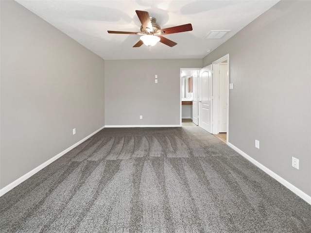 unfurnished bedroom with baseboards, carpet flooring, and visible vents