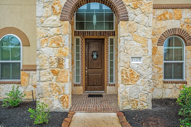 entrance to property with stone siding