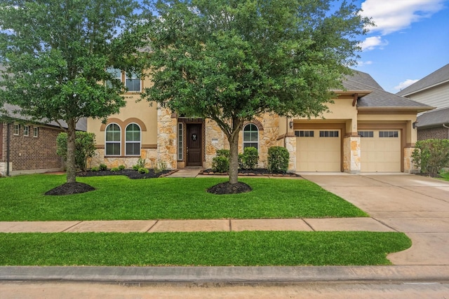 view of front of property with stone siding, an attached garage, concrete driveway, stucco siding, and a front yard