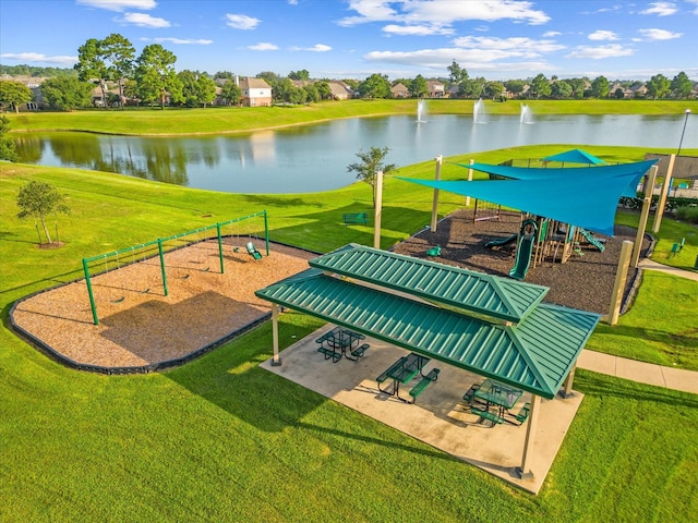 view of home's community with a lawn and a water view