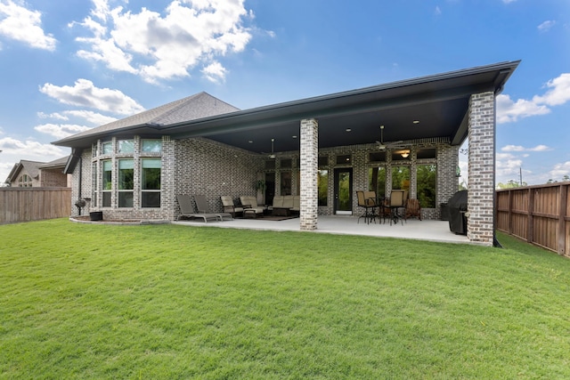 8642 Burdekin Rd, Magnolia, TX 77354 - rear view of property with brick siding, ceiling fan, and a patio