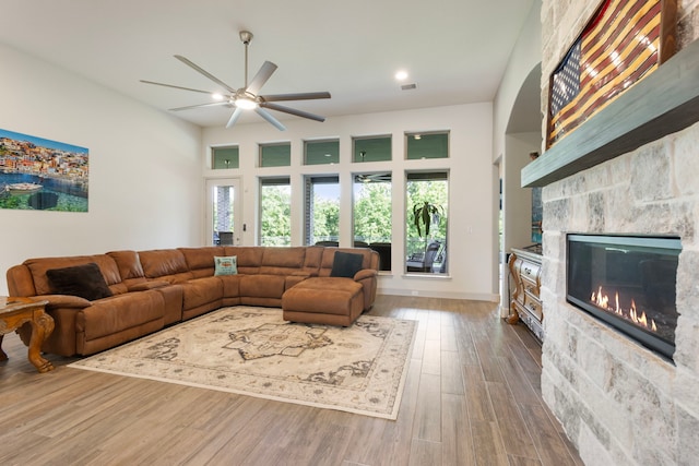 8642 Burdekin Rd, Magnolia, TX 77354 - living area with a ceiling fan, a fireplace, wood finished floors, and recessed lighting