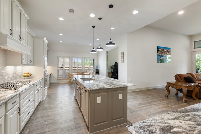 8642 Burdekin Rd, Magnolia, TX 77354 - kitchen featuring a sink, appliances with stainless steel finishes, baseboards, healthy amount of natural light, and recessed lighting