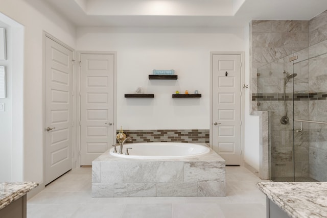 8642 Burdekin Rd, Magnolia, TX 77354 - bathroom with a bath, a stall shower, vanity, and tile patterned floors