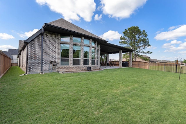 8642 Burdekin Rd, Magnolia, TX 77354 - rear view of property featuring brick siding and a patio area