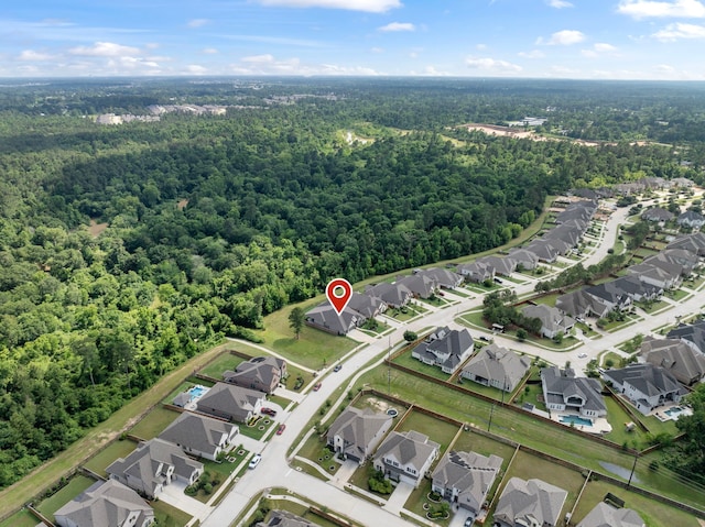 8642 Burdekin Rd, Magnolia, TX 77354 - aerial view of property's location with a heavily wooded area and nearby suburban area