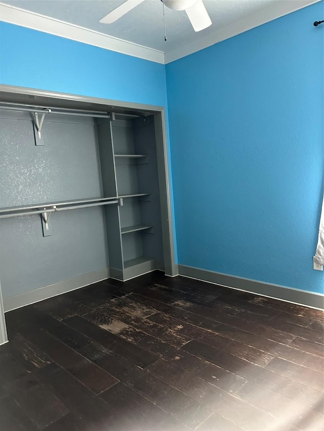 301 Rd 5232, Cleveland, TX 77327 - unfurnished bedroom featuring dark wood-type flooring, baseboards, and a ceiling fan