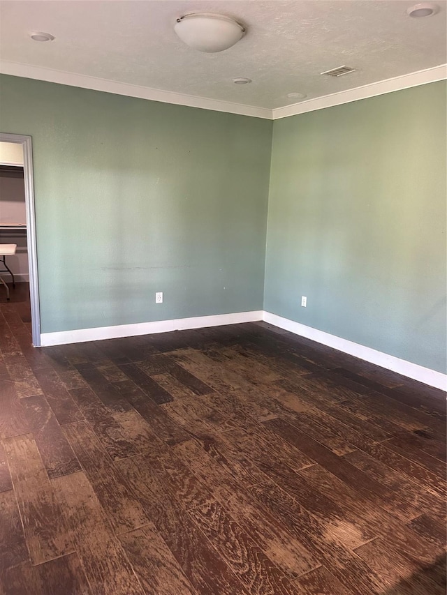 301 Rd 5232, Cleveland, TX 77327 - spare room featuring ornamental molding, baseboards, dark wood-style floors, and visible vents