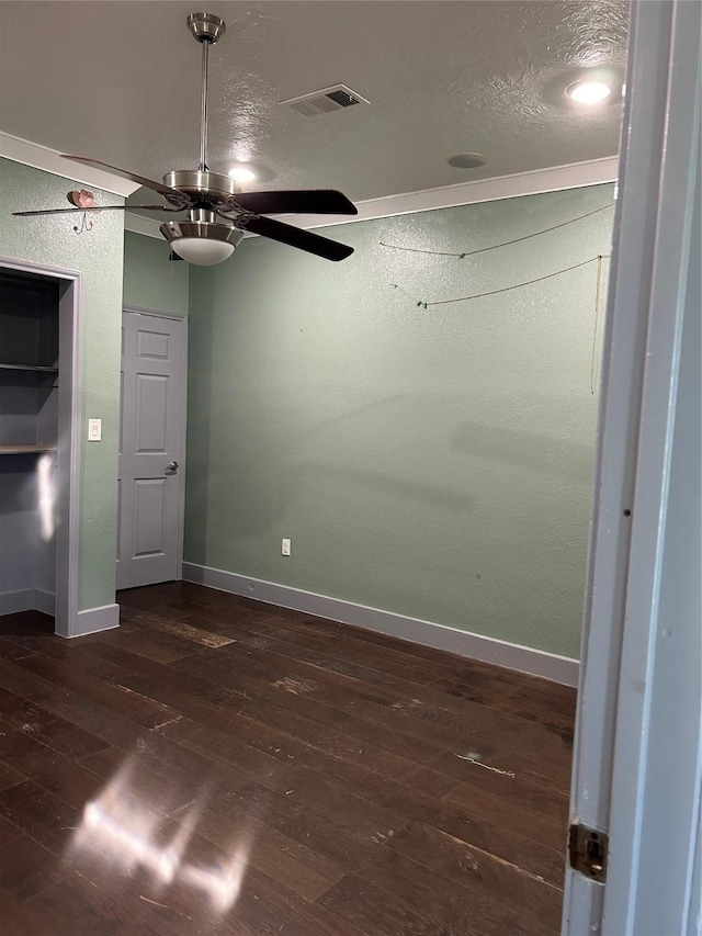 301 Rd 5232, Cleveland, TX 77327 - empty room with a ceiling fan, baseboards, visible vents, and dark wood-type flooring