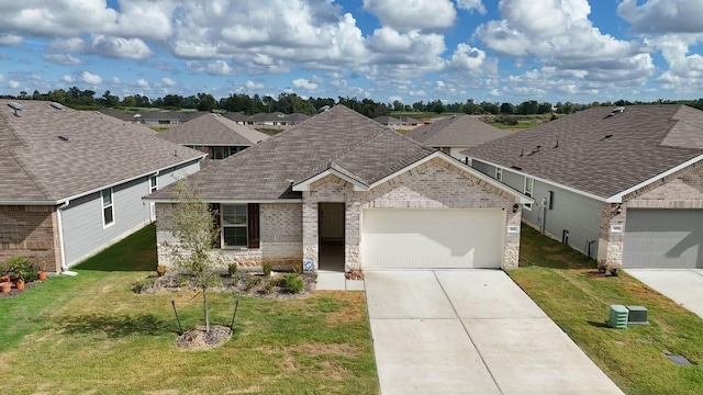 327 Pecos Dr, Huntsville, TX 77340 - view of front facade with an attached garage, driveway, a front lawn, brick siding, and stone siding