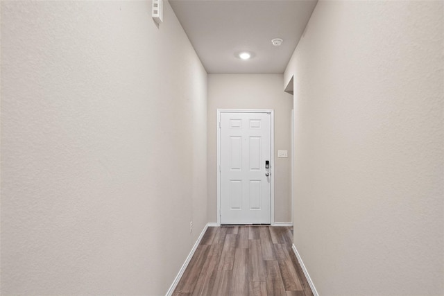 327 Pecos Dr, Huntsville, TX 77340 - hall with baseboards and dark wood-style floors