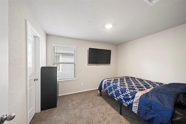 327 Pecos Dr, Huntsville, TX 77340 - carpeted bedroom featuring baseboards and recessed lighting
