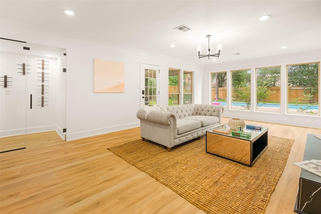 5502 Graystone Ln, Houston, TX 77069 - living room featuring visible vents, recessed lighting, an inviting chandelier, light wood finished floors, and baseboards
