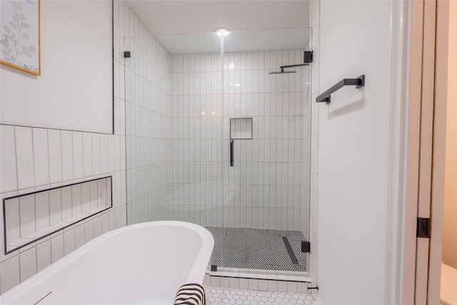 5502 Graystone Ln, Houston, TX 77069 - full bath featuring a soaking tub, tile patterned floors, and a shower stall