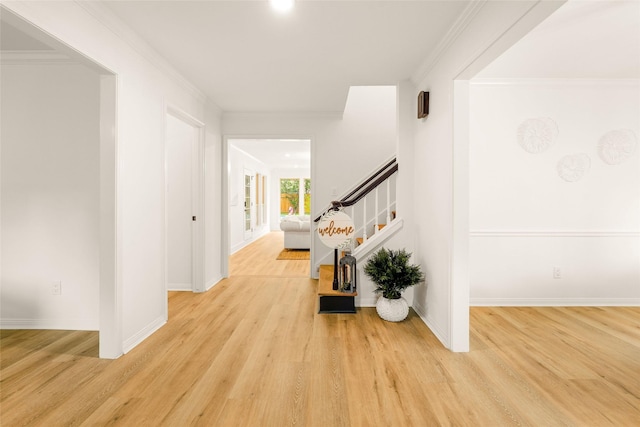 5502 Graystone Ln, Houston, TX 77069 - corridor featuring crown molding, wood finished floors, baseboards, and stairs