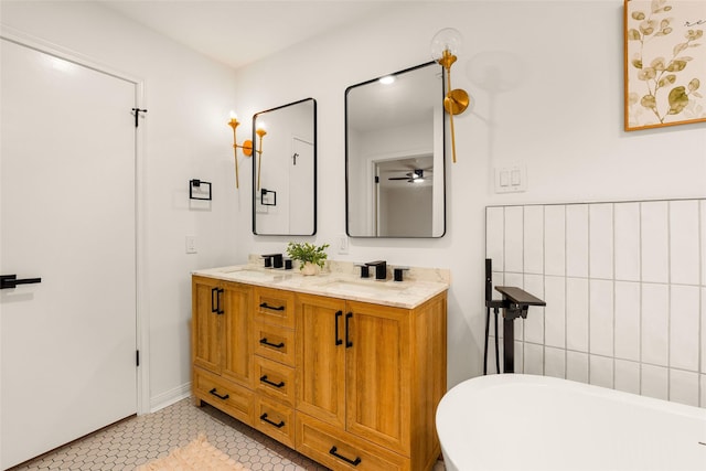 5502 Graystone Ln, Houston, TX 77069 - bathroom with a sink, tile patterned floors, ceiling fan, a freestanding bath, and double vanity