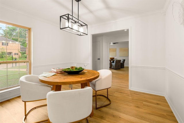 5502 Graystone Ln, Houston, TX 77069 - dining room with light wood finished floors, wainscoting, and ornamental molding