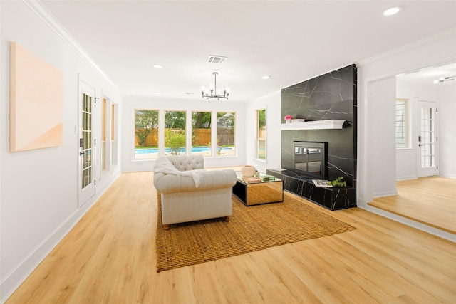 5502 Graystone Ln, Houston, TX 77069 - living area featuring crown molding, recessed lighting, visible vents, and wood finished floors