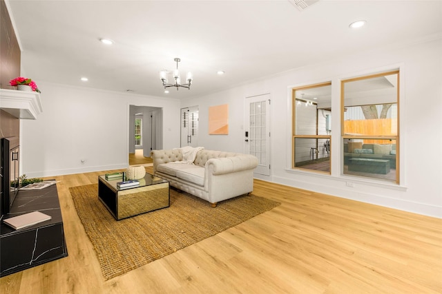 5502 Graystone Ln, Houston, TX 77069 - living area featuring crown molding, recessed lighting, a chandelier, and wood finished floors