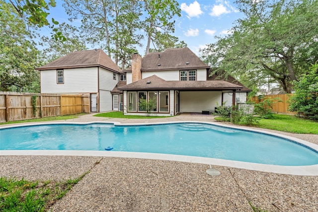 5502 Graystone Ln, Houston, TX 77069 - view of pool featuring a sunroom, a fenced in pool, and a fenced backyard