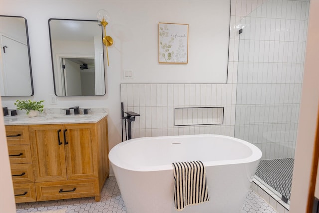 5502 Graystone Ln, Houston, TX 77069 - full bath featuring tiled shower, a soaking tub, tile walls, tile patterned flooring, and vanity