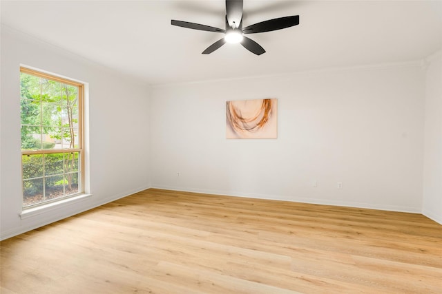 5502 Graystone Ln, Houston, TX 77069 - unfurnished room featuring crown molding, light wood-style flooring, baseboards, and a ceiling fan