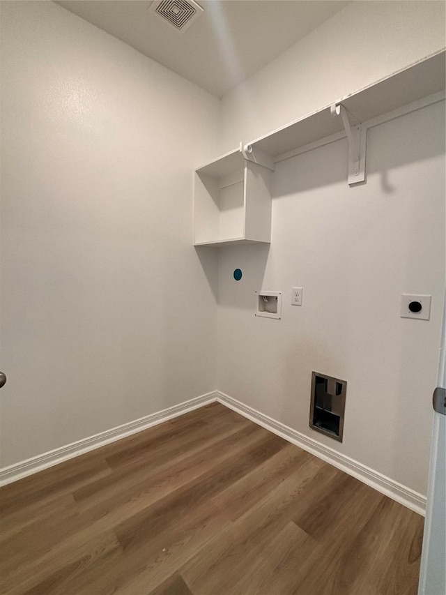 laundry area with baseboards, visible vents, washer hookup, dark wood-type flooring, and laundry area