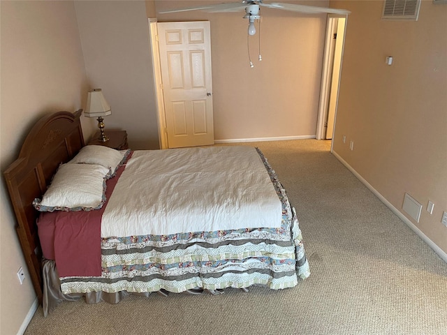 carpeted bedroom with baseboards