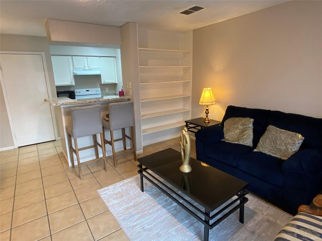 living area with light tile patterned floors