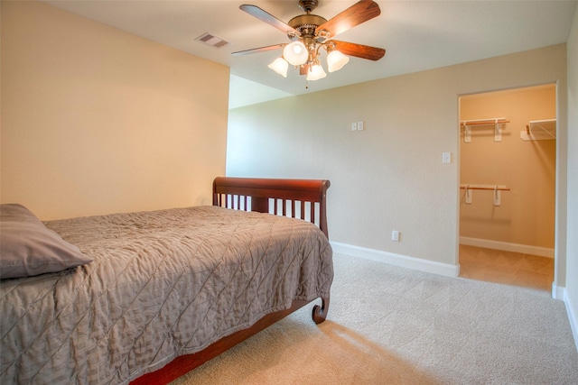 1634 Topaz Trl, Willis, TX 77378 - carpeted bedroom featuring baseboards, a spacious closet, and a ceiling fan