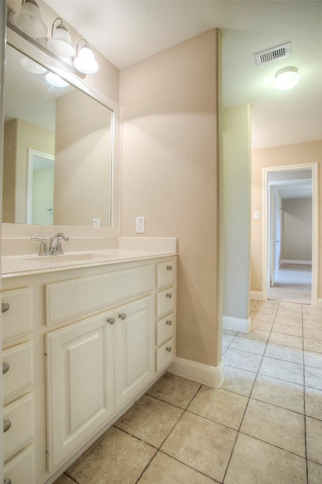 1634 Topaz Trl, Willis, TX 77378 - bathroom with tile patterned flooring, vanity, and baseboards