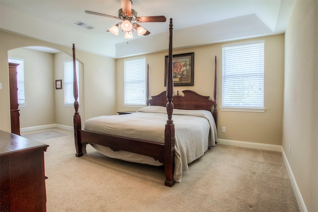 1634 Topaz Trl, Willis, TX 77378 - bedroom with arched walkways, light carpet, and multiple windows