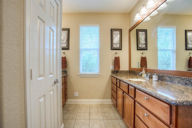 1634 Topaz Trl, Willis, TX 77378 - bathroom with vanity, tile patterned flooring, and baseboards