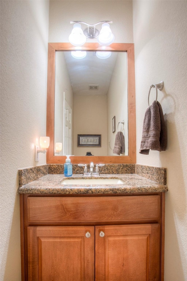 1634 Topaz Trl, Willis, TX 77378 - bathroom featuring vanity and a textured wall