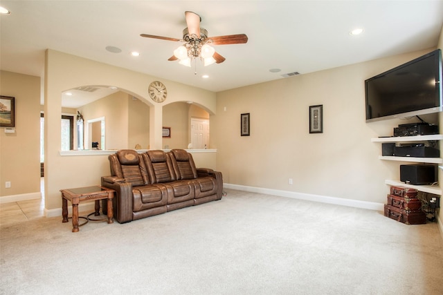 1634 Topaz Trl, Willis, TX 77378 - carpeted living room with arched walkways, recessed lighting, a ceiling fan, and baseboards