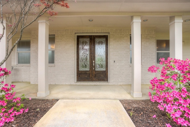 1634 Topaz Trl, Willis, TX 77378 - entrance to property with a porch and brick siding