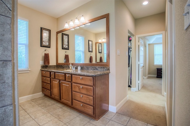 1634 Topaz Trl, Willis, TX 77378 - full bathroom featuring vanity, tile patterned floors, and baseboards
