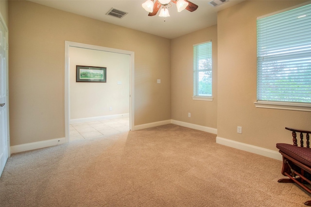 1634 Topaz Trl, Willis, TX 77378 - unfurnished room with a ceiling fan, light colored carpet, plenty of natural light, and baseboards