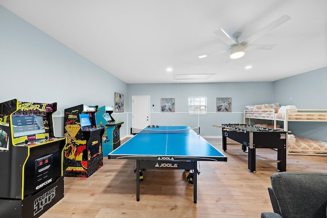 game room featuring attic access, wood finished floors, and a ceiling fan
