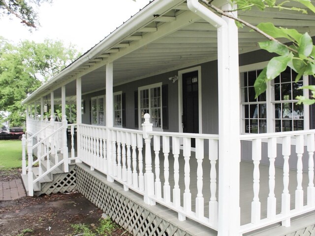 213 Red Haven Dr, Highlands, TX 77562 - view of side of property with a porch