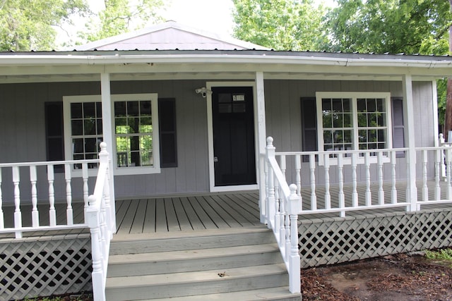 213 Red Haven Dr, Highlands, TX 77562 - property entrance featuring a porch and metal roof