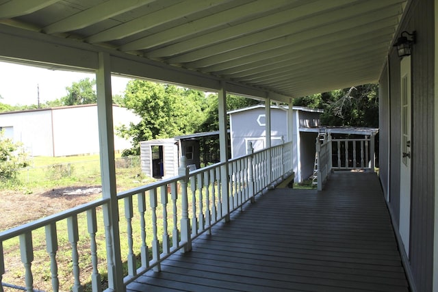 213 Red Haven Dr, Highlands, TX 77562 - deck featuring a shed and an outdoor structure