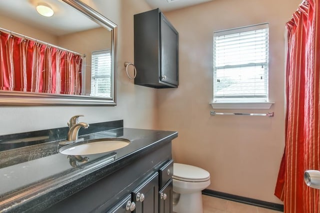 full bath with toilet, tile patterned floors, and vanity