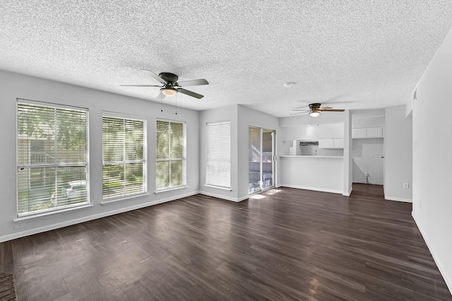 unfurnished living room with ceiling fan, a textured ceiling, and plenty of natural light