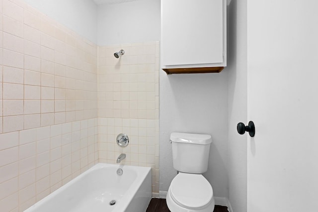 full bathroom with toilet, shower / bathtub combination, and baseboards