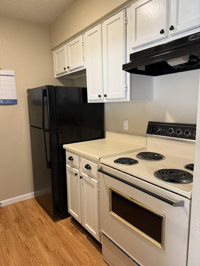 kitchen featuring under cabinet range hood, light wood finished floors, light countertops, white cabinets, and white range with electric stovetop